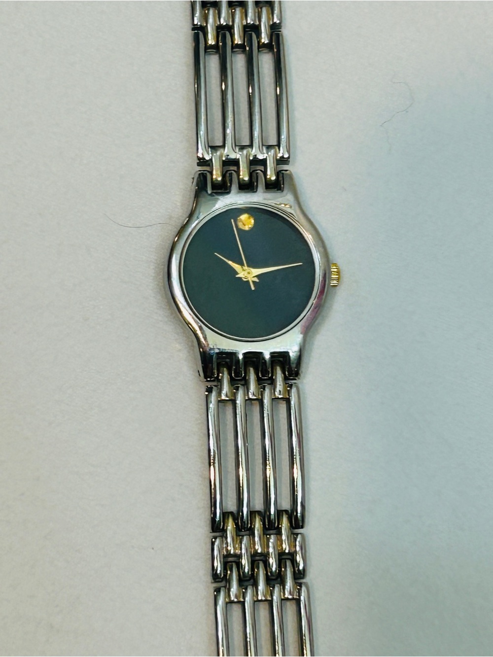 Women's Silver Bracelet Watch with Black Dial and Gold Accents